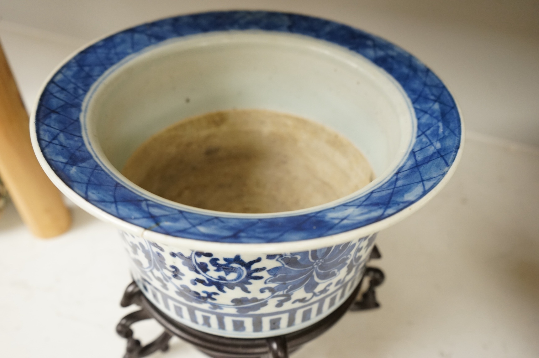 A Chinese blue and white bowl, on stand, 23cm high. Condition - fair